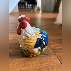 This item is a vintage Fitz and Floyd Ricamo rooster ceramic napkin holder.